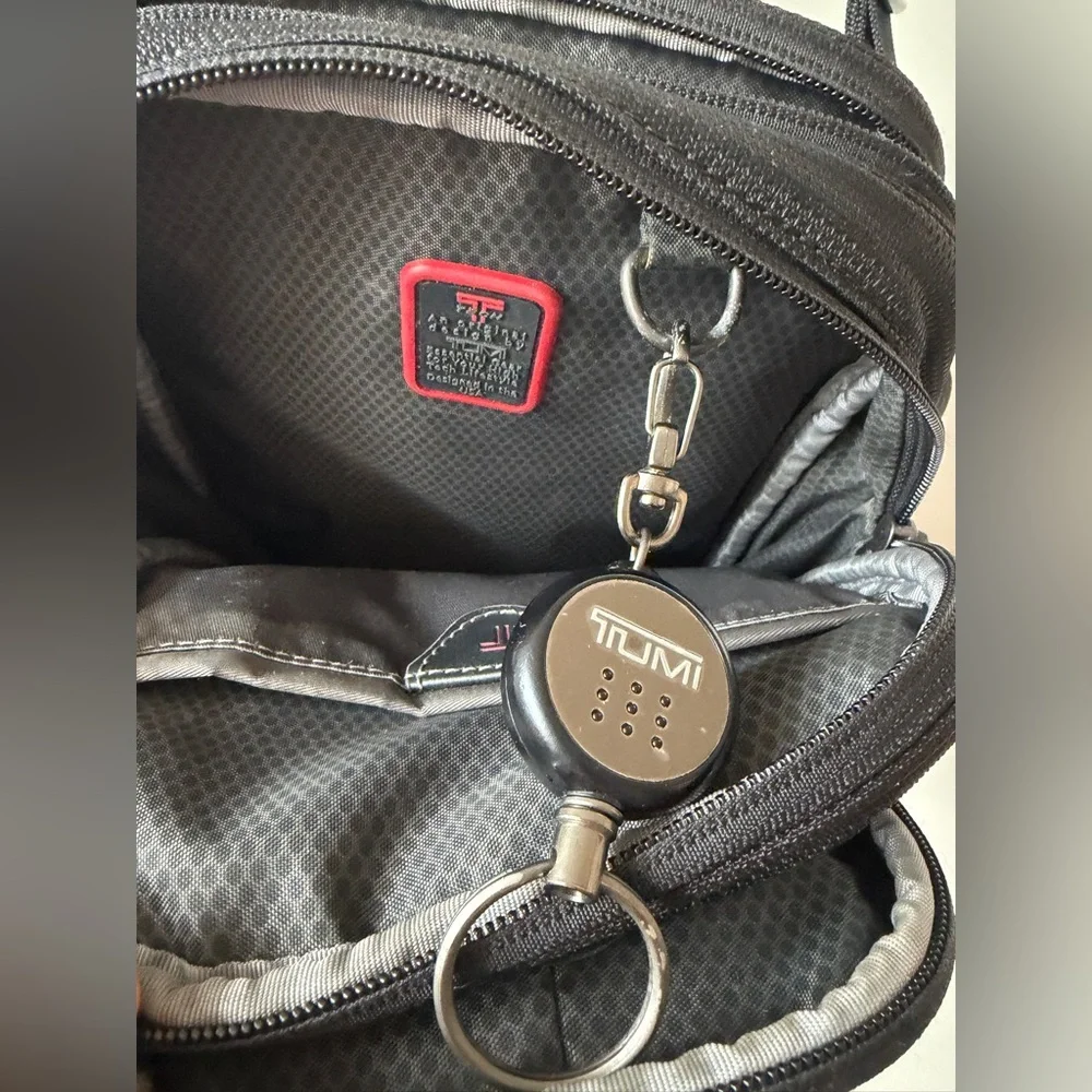 Tumi T-Tech sling bag with multiple compartments and Keychain mens